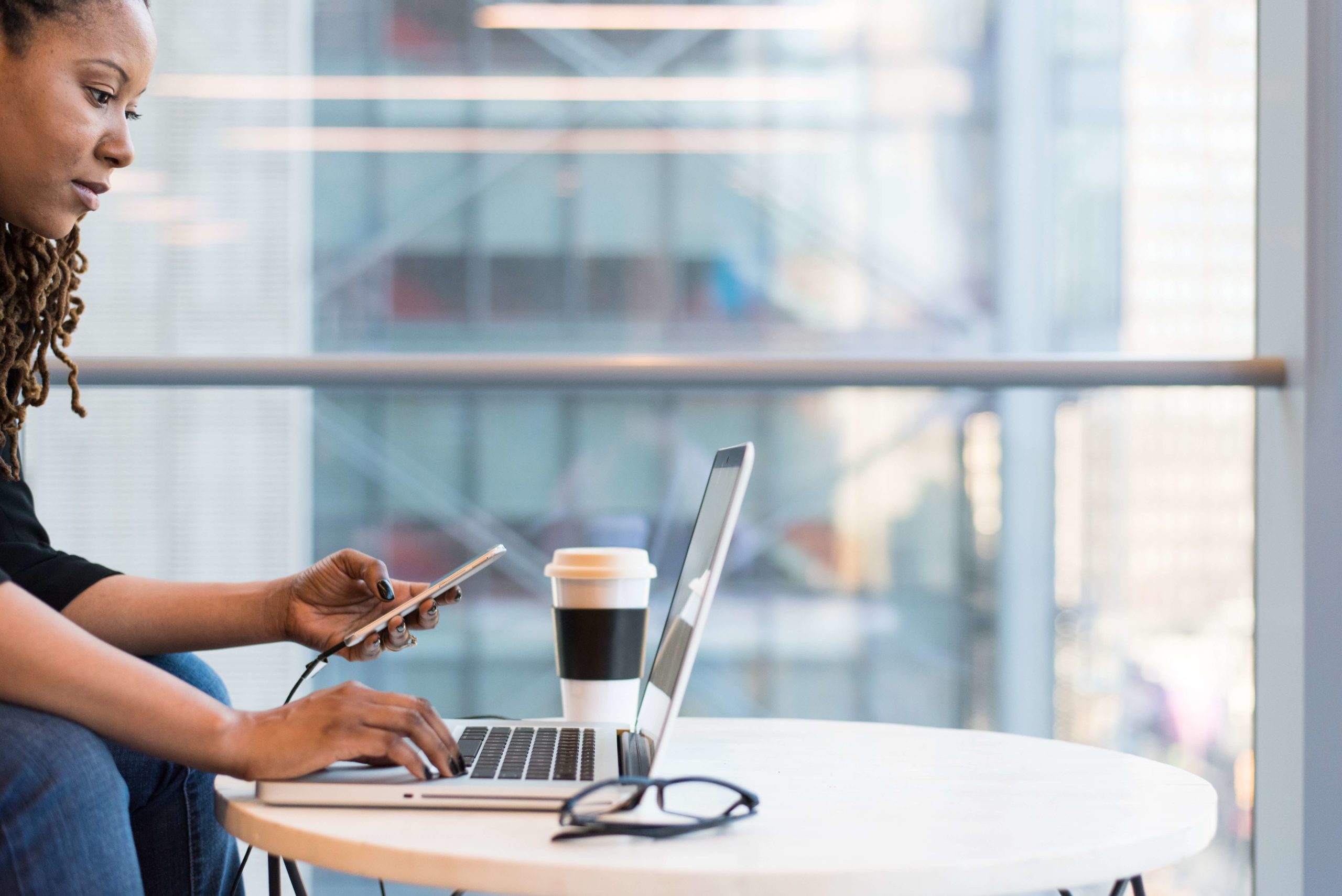 woman using Guest WiFi in a coffee store